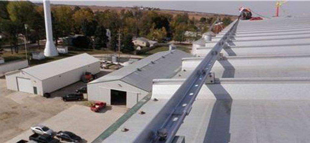 D. C. Taylor Co. installing a snow retention system on a roof.