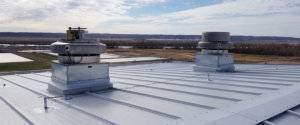 metal commercial roof with horizontal lifeline installation for permanent fall protection