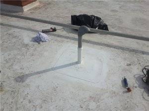 commercial roof penetration of an exhaust pipe newly installed and properly sealed with field wrap flashing